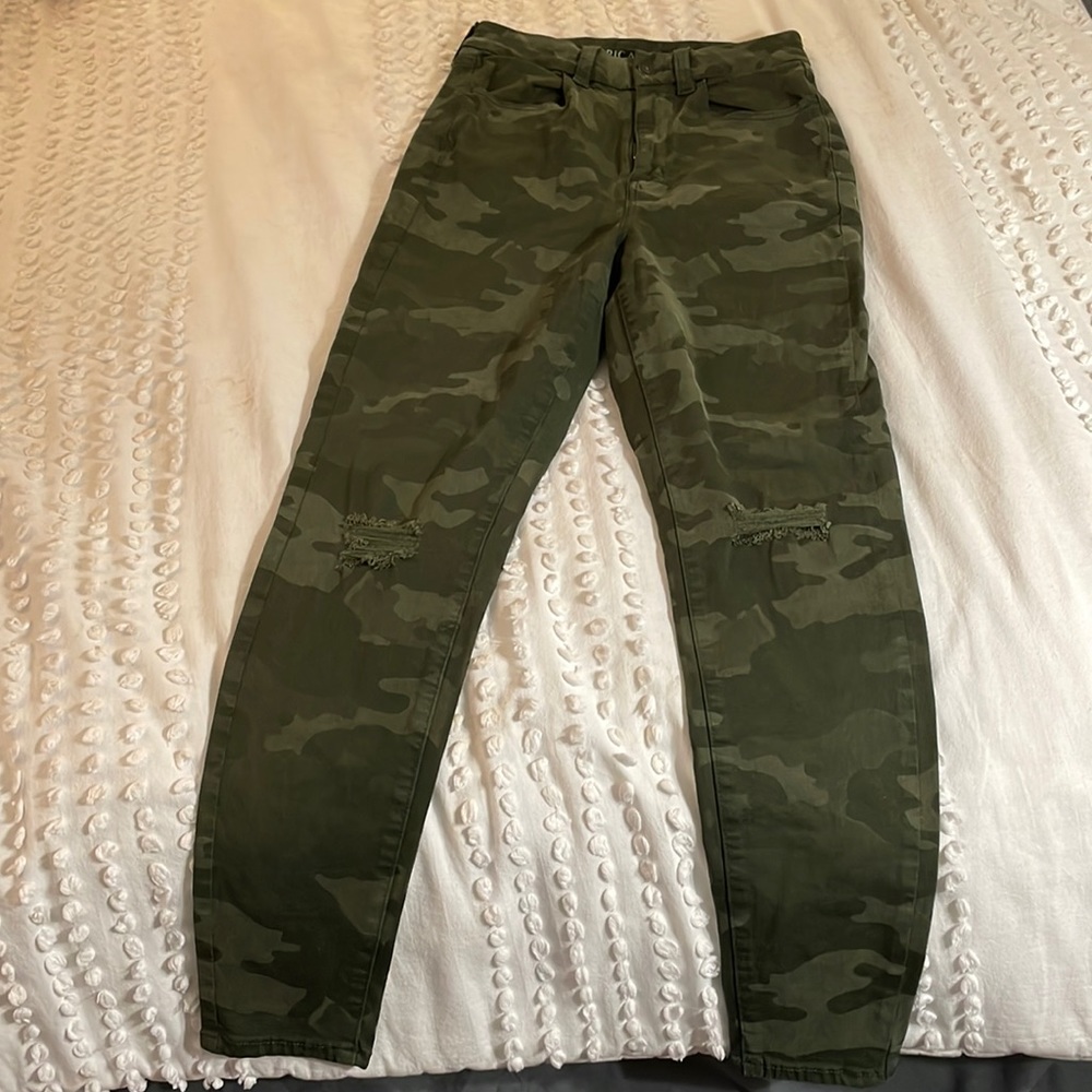 Size 6, camouflage jeans.
